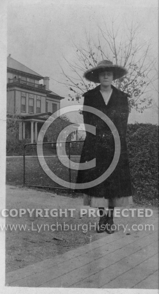 Woman in Front of House