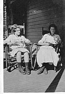 Girl and Woman Sitting on Porch