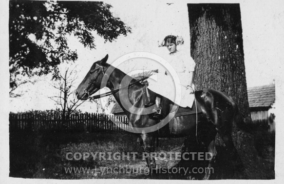 Girl Sitting on Horse
