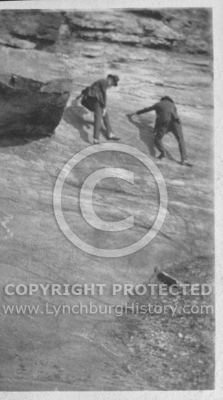 Men Climbing Rock