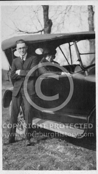Man and Woman Posing With Car
